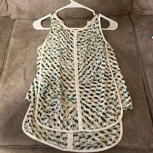 Patterned tank top with opening in back that ties.